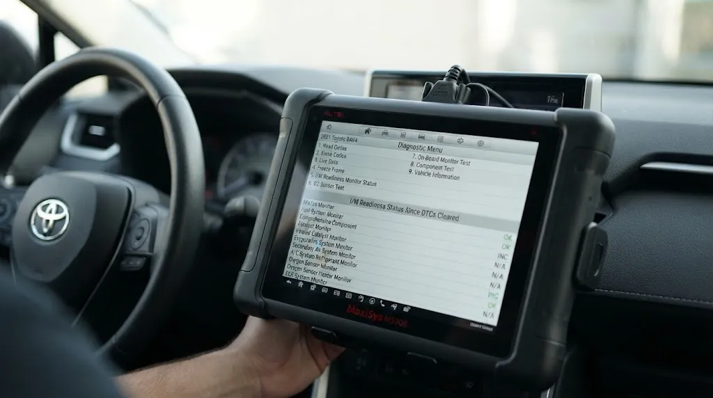 OBD2 scanner screen showing car computer memory reset and readiness status.
